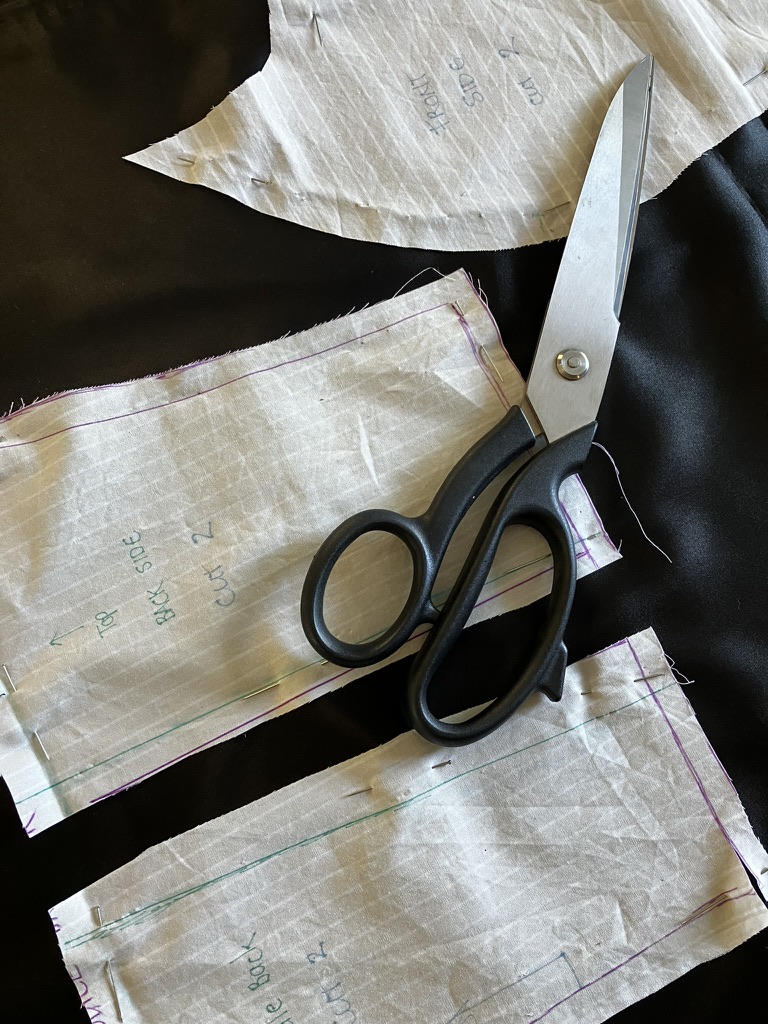 Pattern pieces laid out on a wooden table