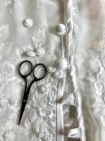 Beaded bridal lace with tailor's scissors