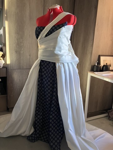 Navy and ivory gown on the stand