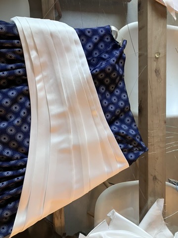 White satin draped over the studio rail