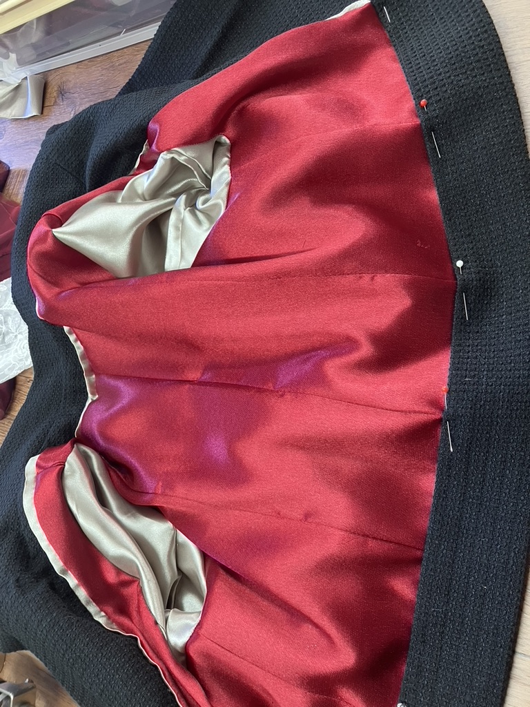 Crimson silk lining inside a tweed jacket