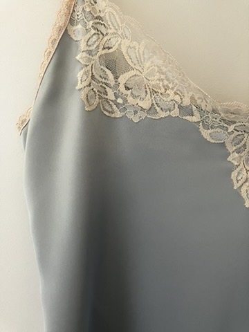 Ice blue satin with ivory lace neckline