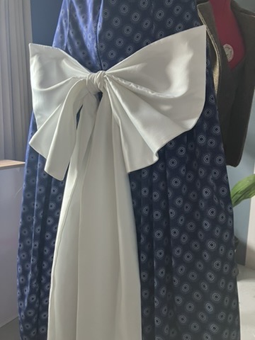 Hand-tied satin bow on a bridal party dress